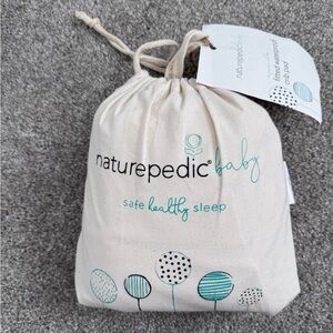 NWT Naturepedic fitted waterproof crib pad
